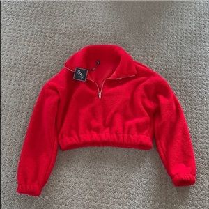 A red cropped sweater